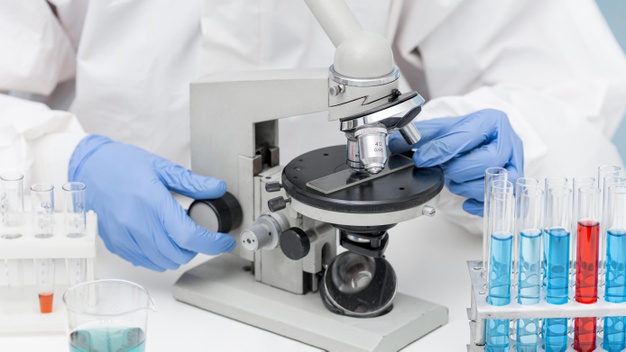 scientist-looking-substance-through-microscope_23-2148697257